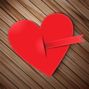 وکتور قلب قرمز با حاشیه دوخته شده در پس زمینه پارکت چوبی